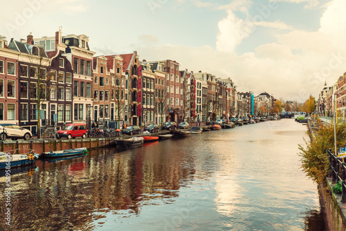 Canal at the red district in the historic old city of Amsterdam with blue sky, the Netherlands