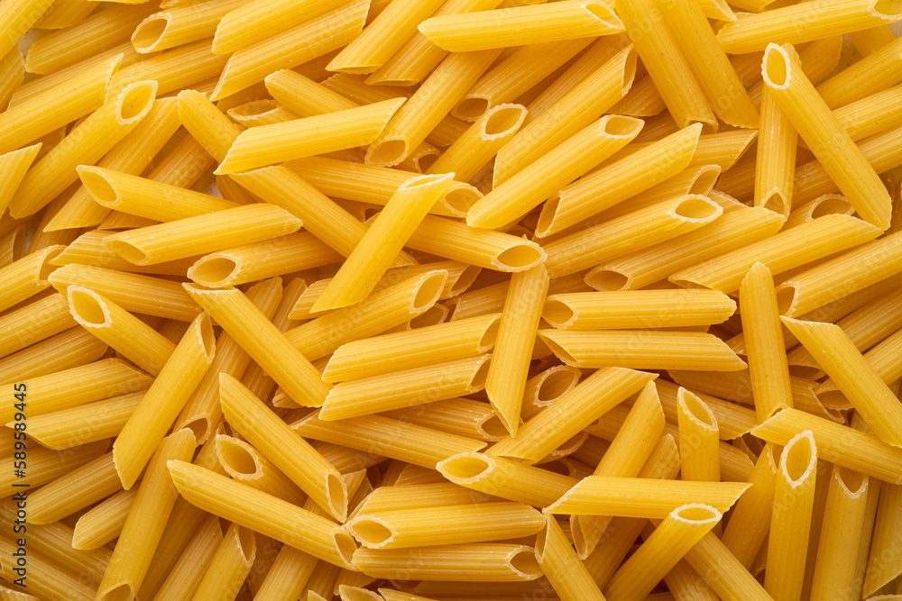 uncooked Penne rigate pasta for background.Top view uncooked Penne rigate pasta for background.Top view