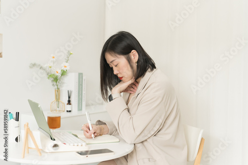 asian business and writer woman writing new her idea on book