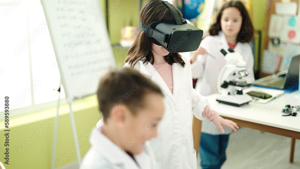 Group of kids students using virtual reality glasses at laboratory classroom Group of kids students using virtual reality glasses at laboratory classroom