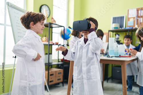 Group of kids students using virtual reality glasses at laboratory classroom