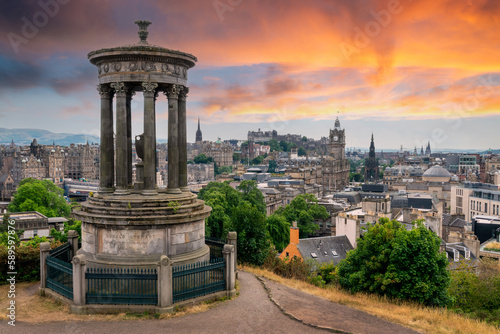 Aerial view of the town and castle of Edinburgh with Dugald Stewart monument in Scotland at sunset