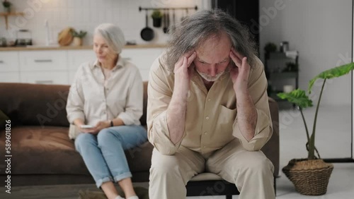 Unsuccessful relationships, failed marriage, relations break up, misunderstanding. Silent sad older married couple sit on sofa separately ponder over problems feel dissatisfied, thinking about divorce