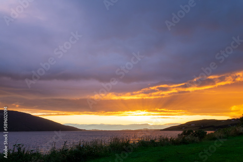 Dramatic sunset over Loch Broom in Ullapool, Highlands, Scotland UK