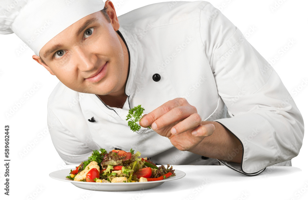 Portrait of a male chef cook preparing salad isolated on a white background Portrait of a male chef cook preparing salad isolated on a white background