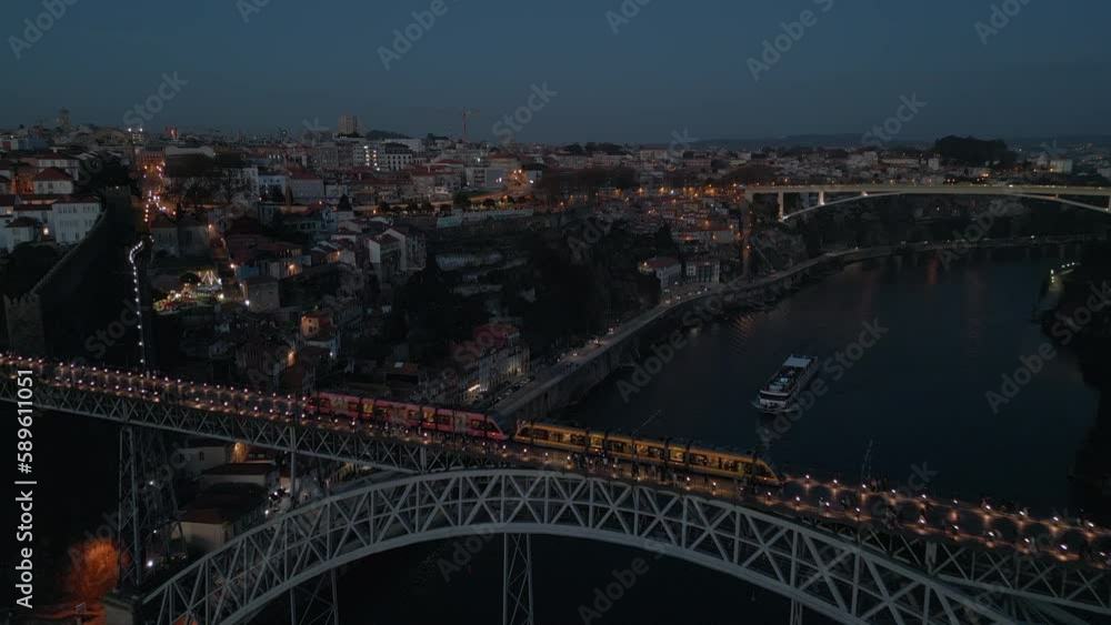 Aerial view of train crossing the Dom Luis I Bridge at dusk in Porto (Oporto), Portugal. Aerial view of train crossing the Dom Luis I Bridge at dusk in Porto (Oporto), Portugal.