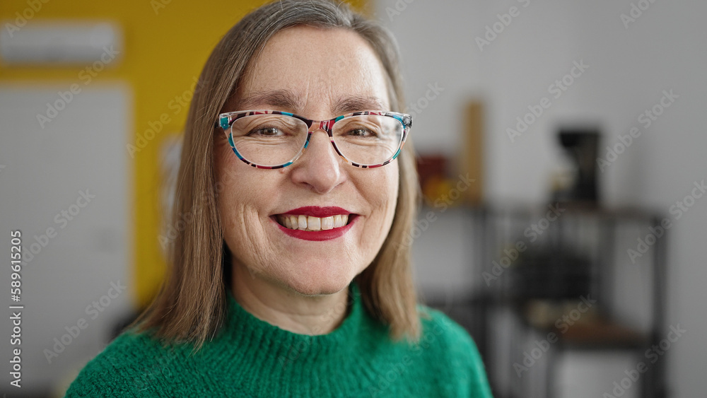 Mature hispanic woman with grey hair smiling confident at office Mature hispanic woman with grey hair smiling confident at office