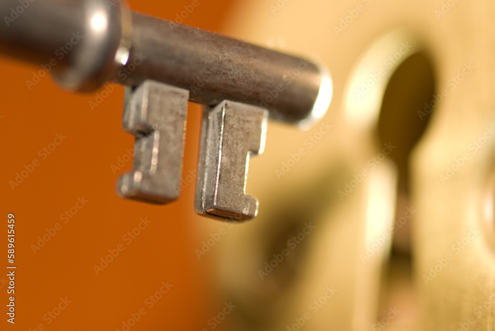 Key and keyhole. Selective focus Key and keyhole. Selective focus
