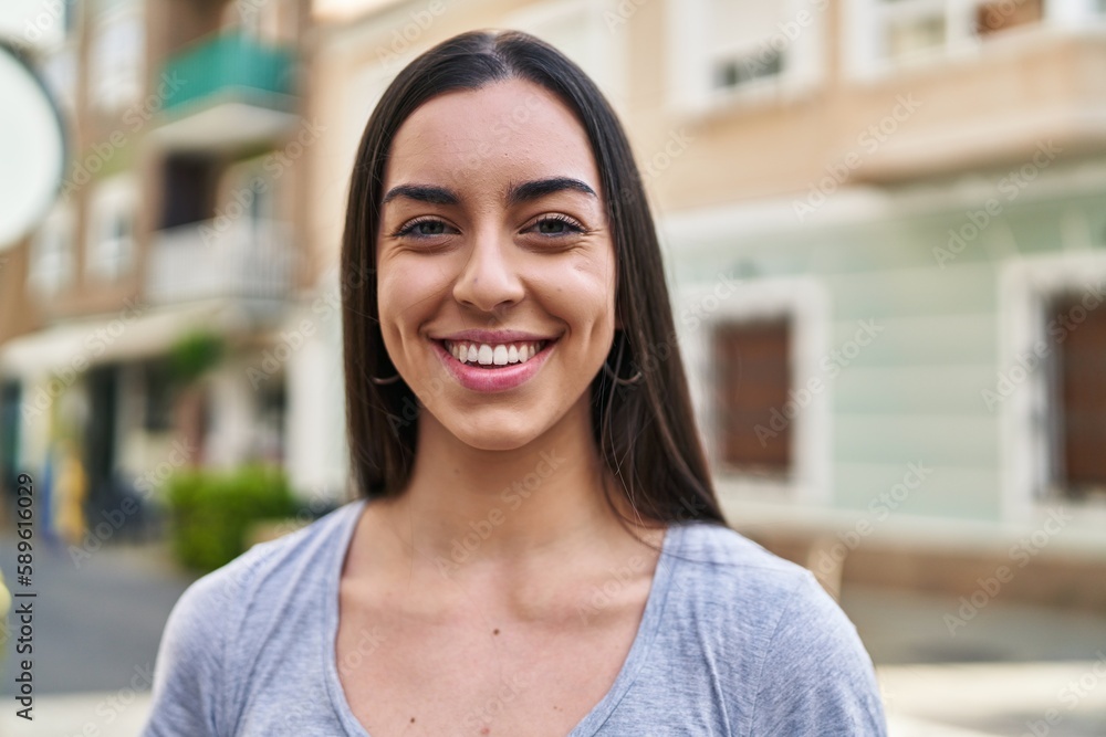 Young beautiful hispanic woman smiling confident standing at street Young beautiful hispanic woman smiling confident standing at street