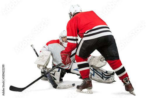 фотографія Male ice hockey players in helmets holding hockey sticks and playing on a white