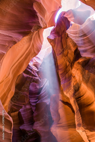 Light beams at Upper Antelope Canyon in the Navajo Reservation Page Northern Arizona. Spectacular and most famous slot canyons in the world. The rays of direct sunlight radiating down from the holes.