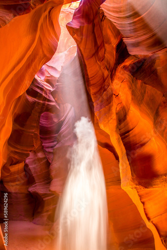 Upper Antelope Canyon in the Navajo Reservation Page Northern Arizona. Famous slot canyon. Light showing off the detail of the rock arches where the falling sand looks like a ghost bride.