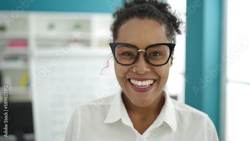 African american woman student smiling confident standing at library university