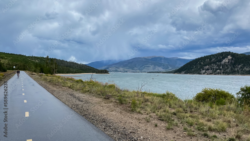 Colorado bike path through the forest and mountain lake