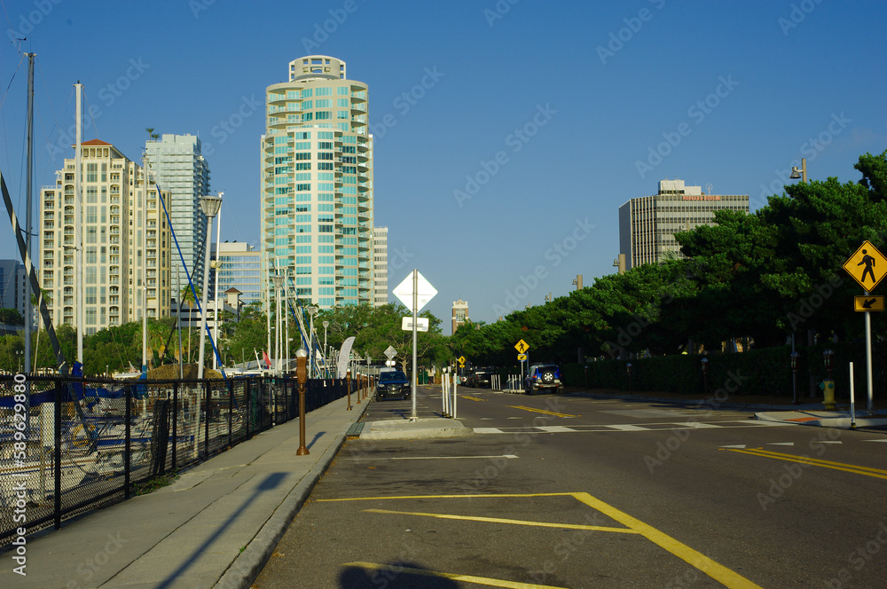 City Scape with Marina in foreground. Water reflections on a sunny morning. City Scape with Marina in foreground. Water reflections on a sunny morning.