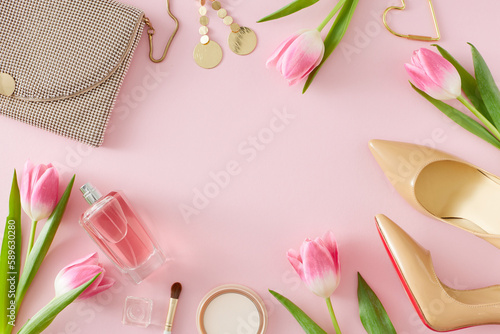 Top view photo of perfume bottle cosmetic brush and bijouteries earrings beige women shoes handbag and pink tulips on pastel pink background with blank space. Mother's Day concept