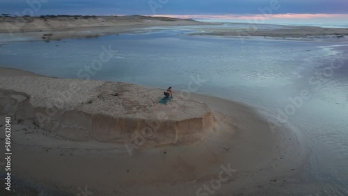 Reverence to the sun with voluptuousness and strength during a yoga training on the Atlantic ocean in Moliets, France