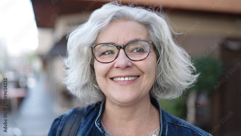Middle age woman with grey hair smiling confident at street Middle age woman with grey hair smiling confident at street
