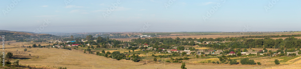 Landscapes of the Northern regions of Moldova. A pastoral panorama with nature. Moldovan villages and houses and streets.