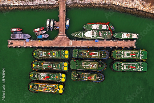 Tug boats moored in a port, Aerial view. photo