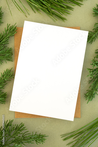 holiday card mockup with pine branches and ornaments