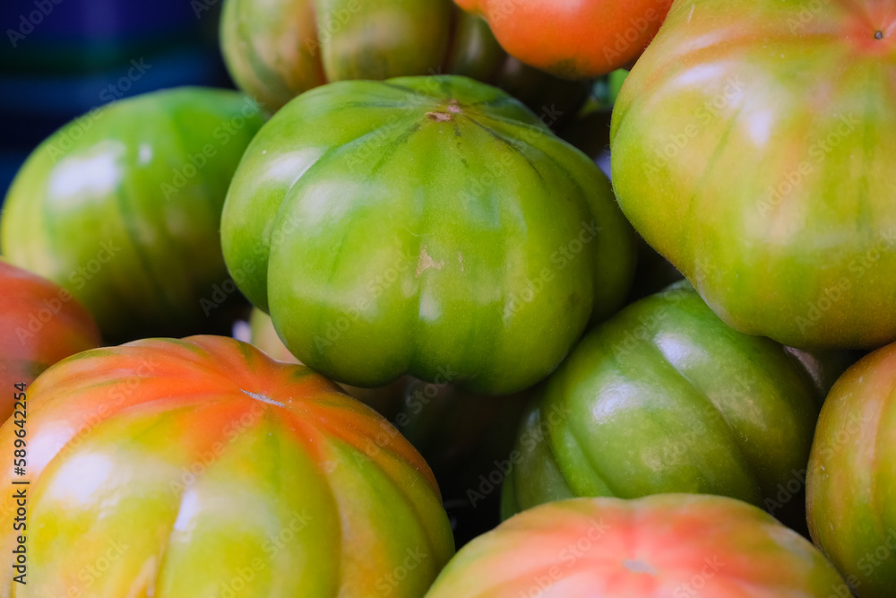 green and red tomatoes close up, healthy food, organic market
