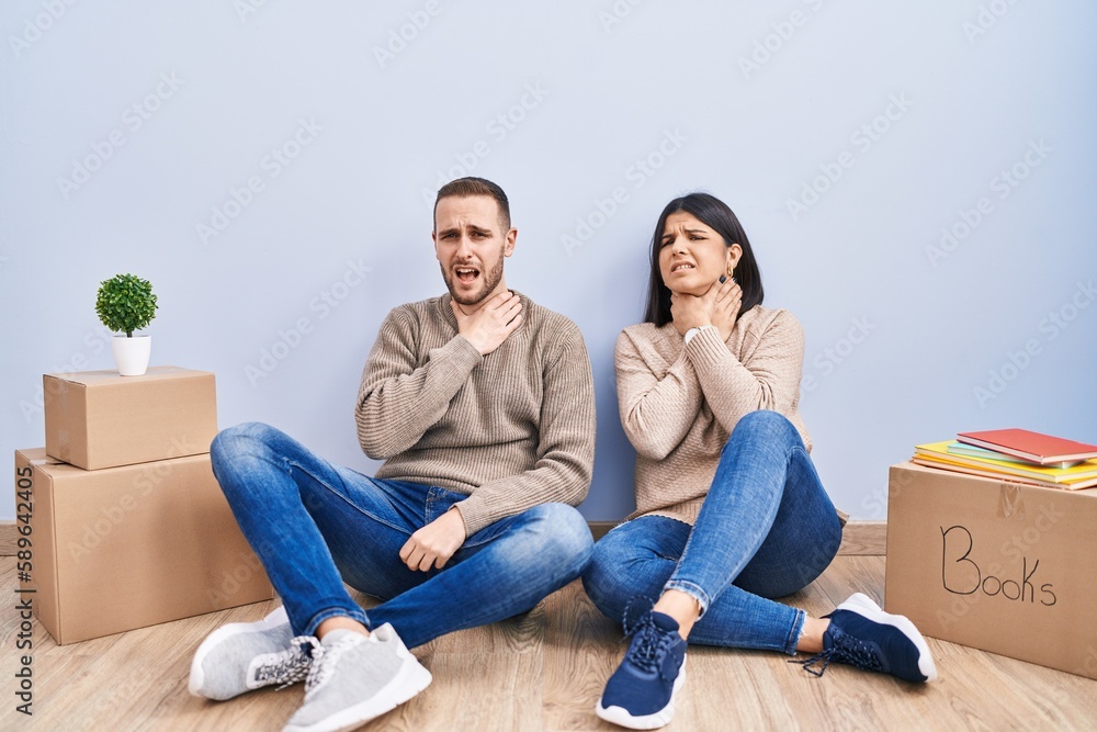 Young couple moving to a new home shouting suffocate because painful strangle. health problem. asphyxiate and suicide concept. Young couple moving to a new home shouting suffocate because painful strangle. health problem. asphyxiate and suicide concept.