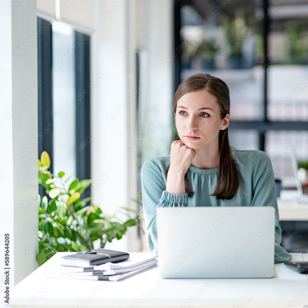 Millennial confident Female working in creative office.. Millennial confident Female working in creative office..