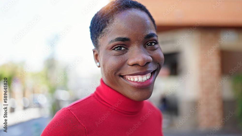 African american woman smiling confident standing at street