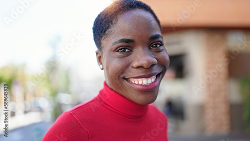 African american woman smiling confident standing at street © Krakenimages.com