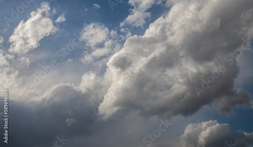Bild auf Leinwand Beautiful huge fluffy clouds on the blue sky