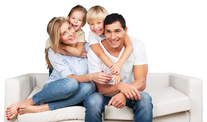 Beautiful smiling family sitting at sofa at home