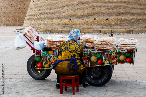 Wallpaper Mural a woman sells tandoor tortillas on a cart in uzbekistan Torontodigital.ca