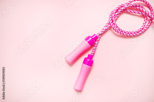 skipping rope on a pastel pink background. minimalism. place for text. copy space