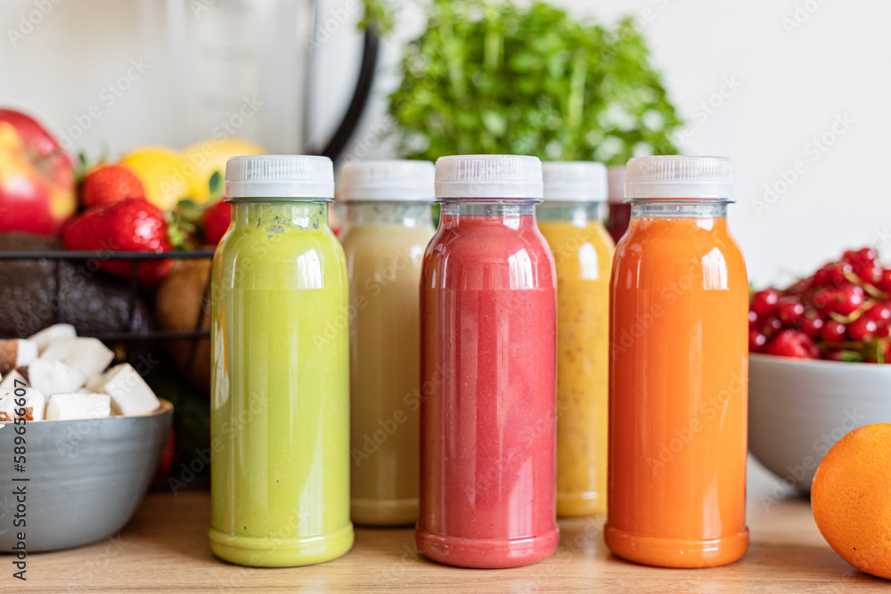 Healthy fresh fruit and vegetable smoothies with assorted ingredients of various colors and tastes. Superfood detox and diet food concept Healthy fresh fruit and vegetable smoothies with assorted ingredients of various colors and tastes. Superfood detox and diet food concept