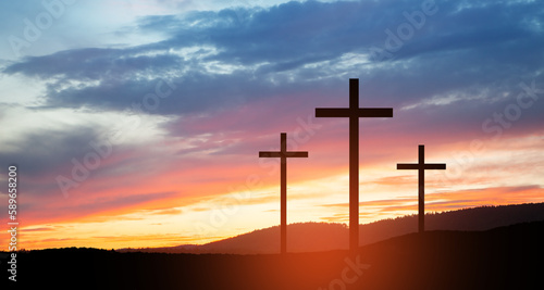 Christian crosses on hill outdoors at sunrise. Resurrection of Jesus. Concept photo.