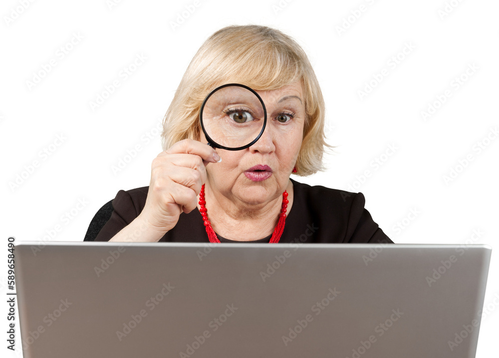 Shocked Old Woman Looking Through Loupe and Using Laptop - Isolated Shocked Old Woman Looking Through Loupe and Using Laptop - Isolated