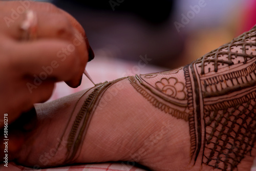 Beautiful mehndi decorated hands Mehndi applying brides and girls hands with beautiful mehndi applied