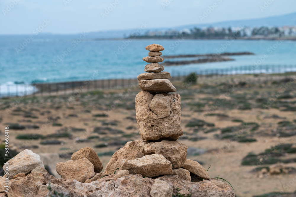 Stacked pebble stones at the beach of Paphos, Cyprus Stacked pebble stones at the beach of Paphos, Cyprus