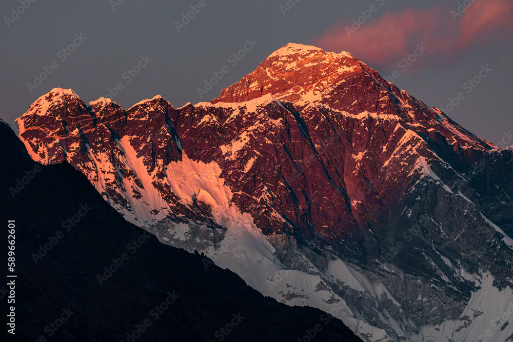 Pink sunset at Mount Everest and Nuptse with marshmallow cloud over  Everest 