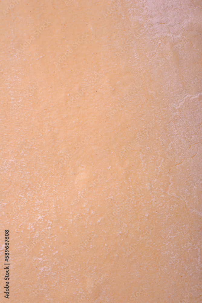 Fototapeta premium Sheets of raw puff pastry on a dark concrete background