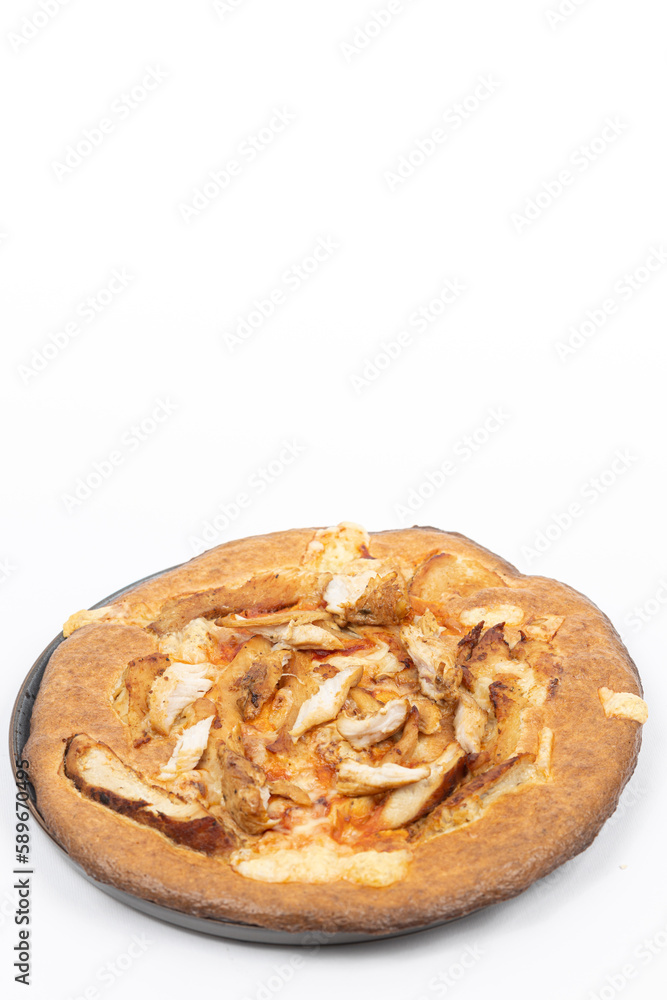 Tasty pizza with chicken breasts served on the plate above white background. Top view