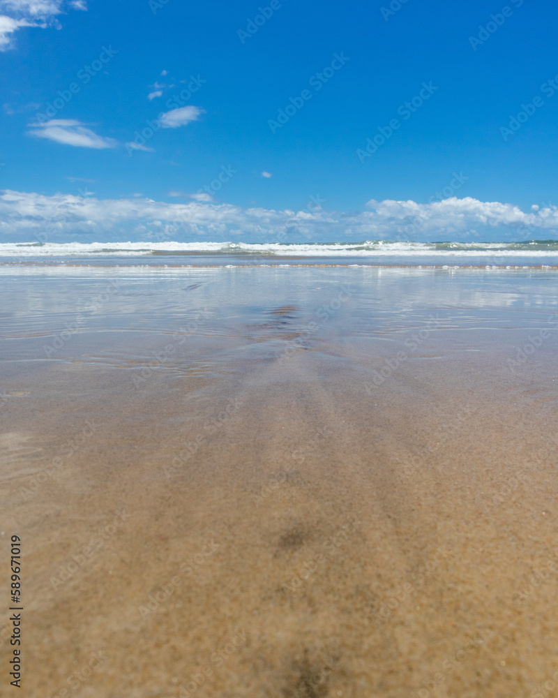 View of an Atlantic Ocean beach in the far north of Brazil. Futuro beach, Fortaleza, State of Ceara, Brazil. Sun, sea, sand, clouds and leasure. Tourism.