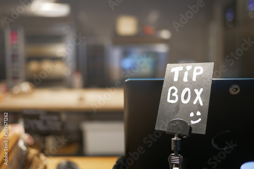 close up of a tips box in a cafe 