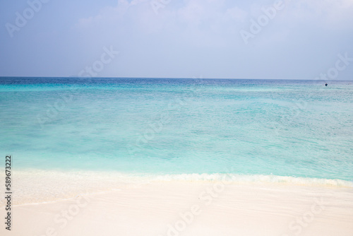 beautiful exotic tropical beach and stormy clouds