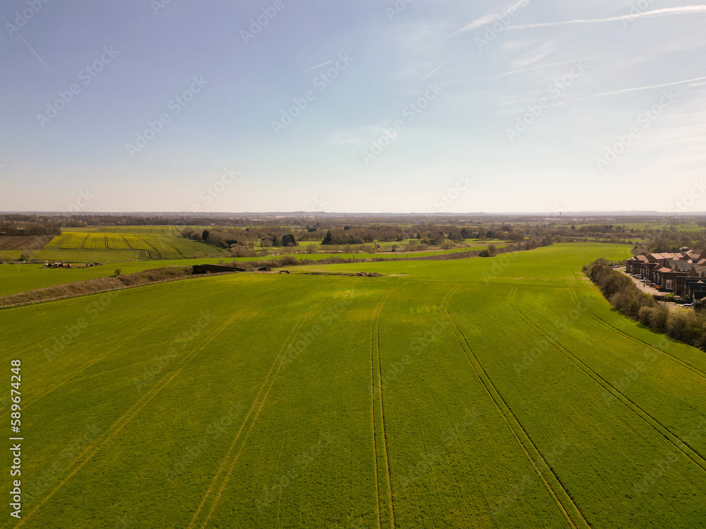 Naklejka premium Aerial view of a farm fields in a sunny day