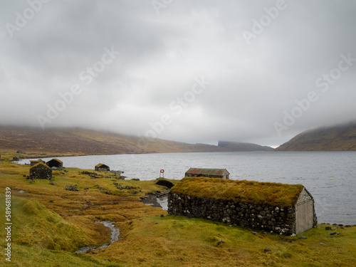 Turf roof boathouses by Sørvágsvatn lake photo