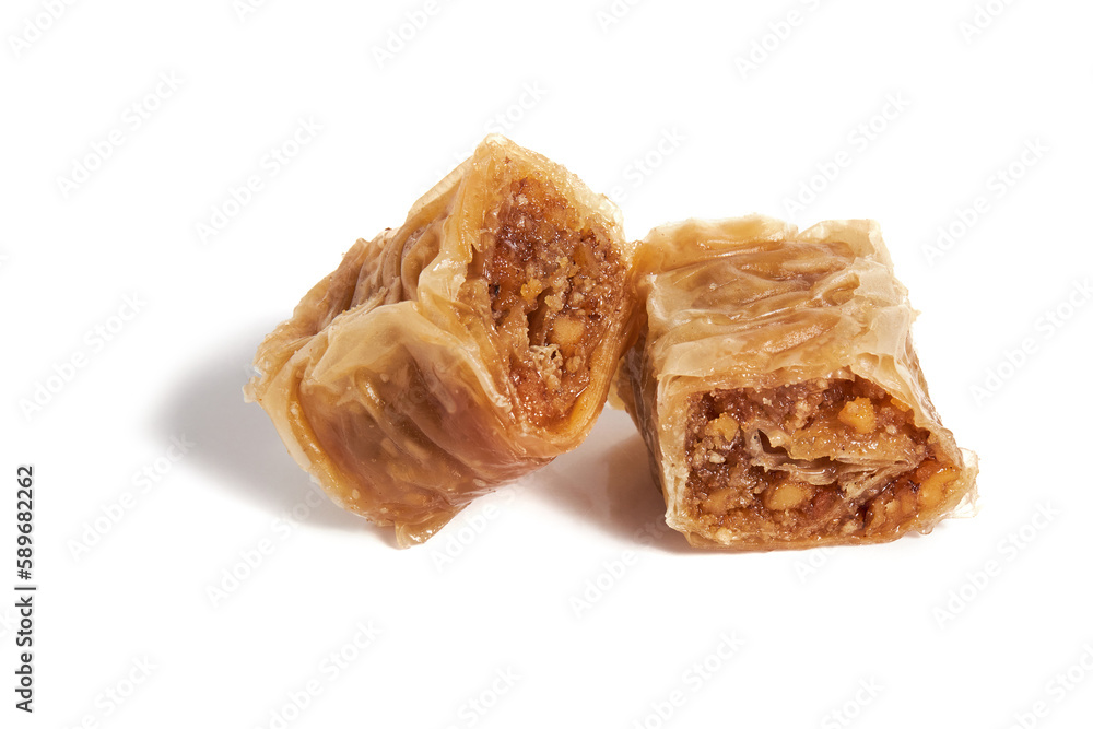 Turkish sweet pastry baklava with walnuts isolated on white background. Turkish sweet pastry baklava with walnuts isolated on white background.