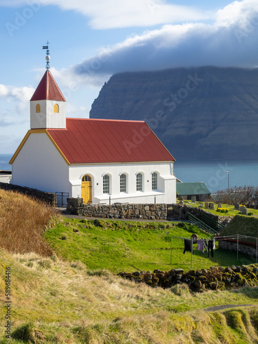 Mikladalur church with Kunoy island in background photo