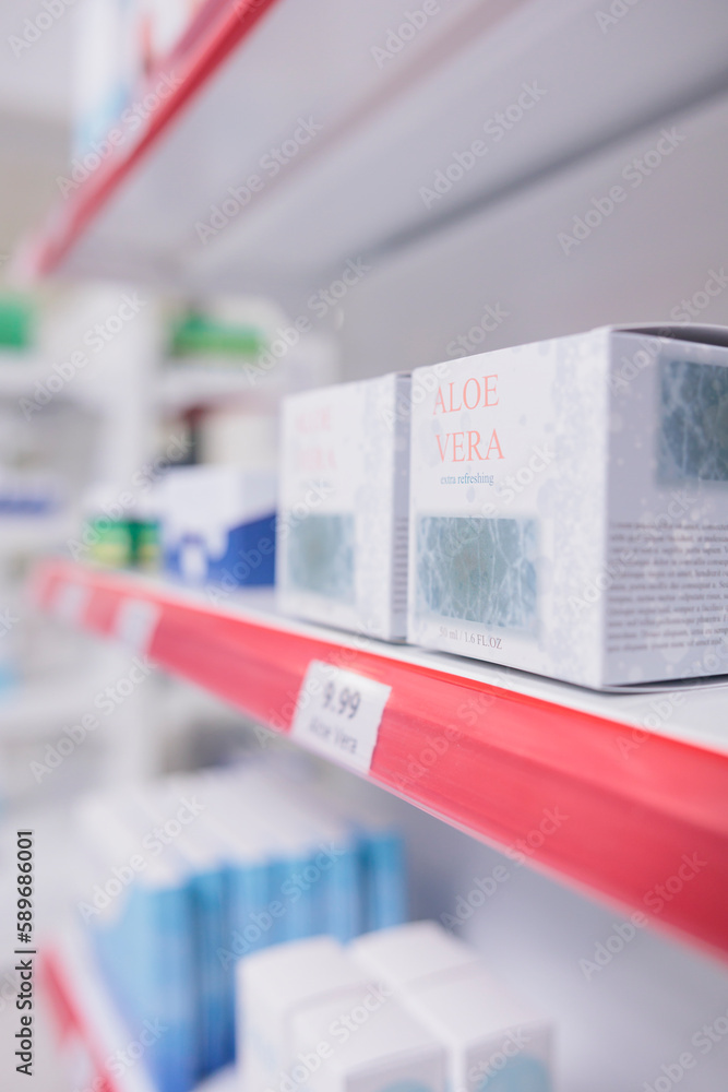 Aloe vera facial cream standing on pharmacy shelves waiting for clients to come and buy during checkup visit. Drugstore filled with pharmaceutical products and vitamins. Health care concept